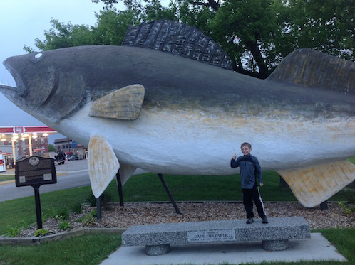Griffin in front of huge walleye statue