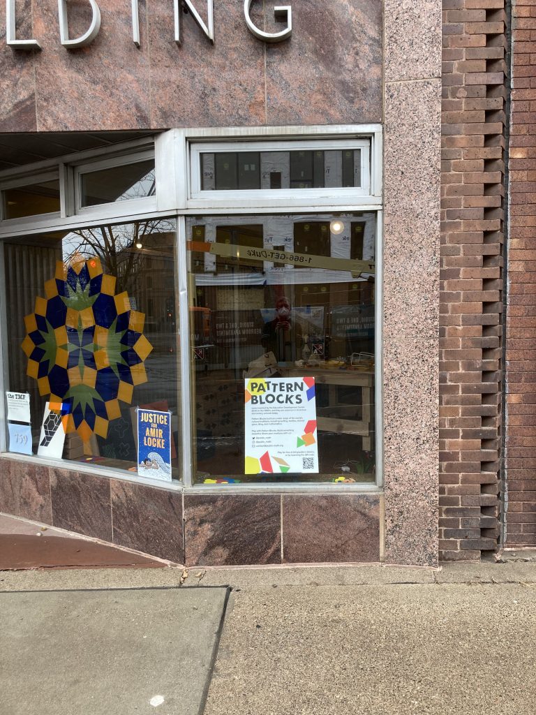 A second window, adjacent to the first larger one. This one has a sign reading "Pattern Blocks" prominently displayed, with additional text too small to read.