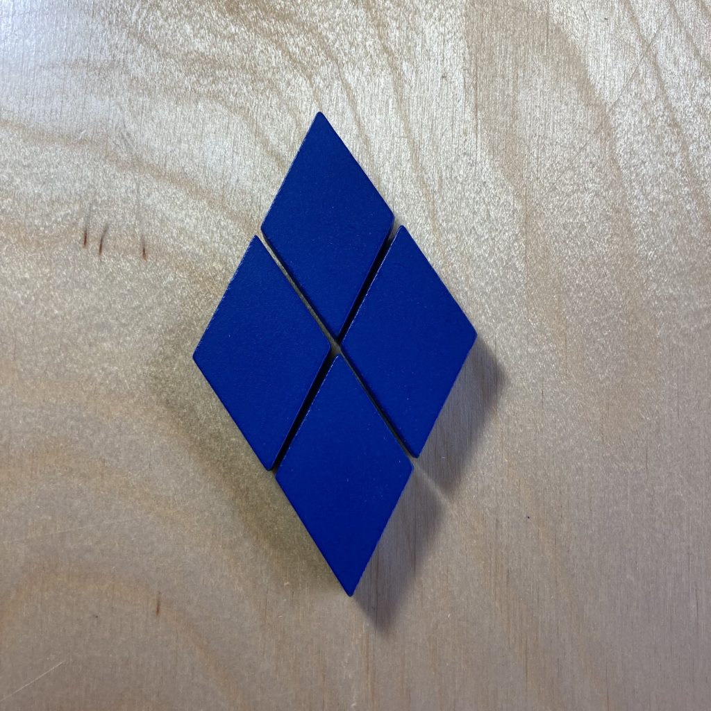Four small blue diamonds tiled to make a larger, similar diamond.