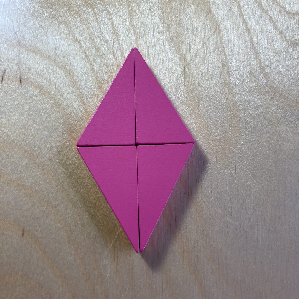 Four pink right triangles tiled to make a diamond (rhombus)