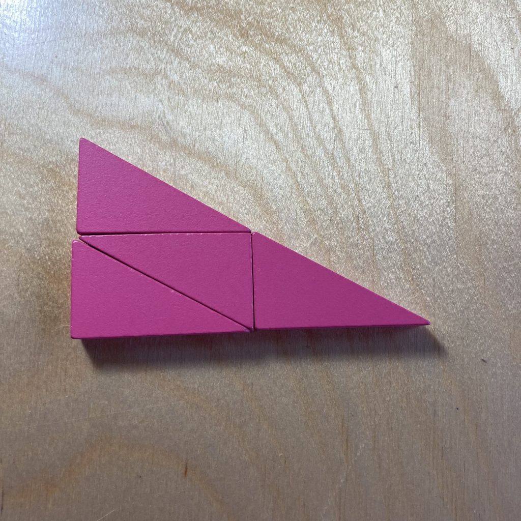 Four pink right triangles tiled to make a larger, similar triangle.