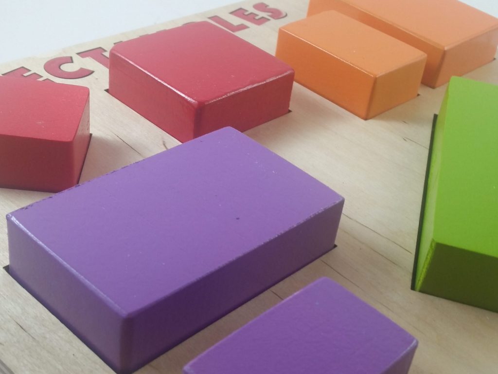 close-up perspective view of a colorful wooden rectangles puzzle with multiple rectangles of different sizes and orientations