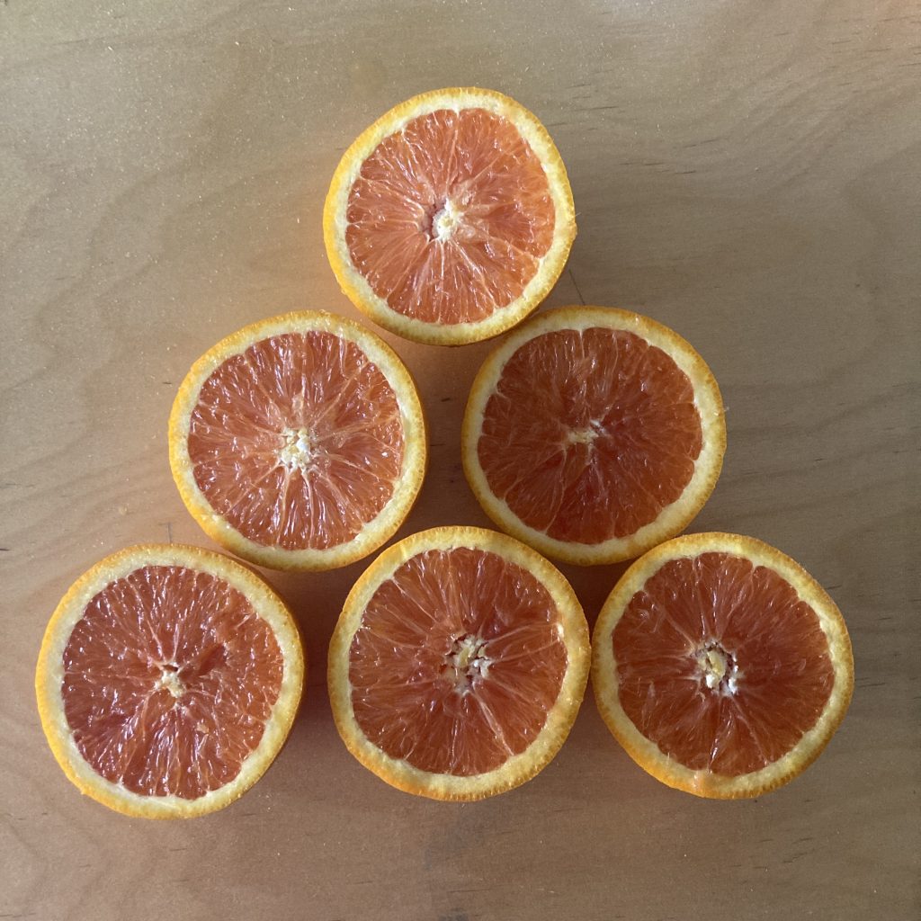 The same arrangement, but this time they are HALF oranges.