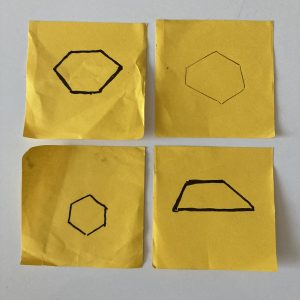 Four Post-Its in a two-by-two grid, each with a hand-drawn polygon. There are three approximately-regular hexagons and a trapezoid.